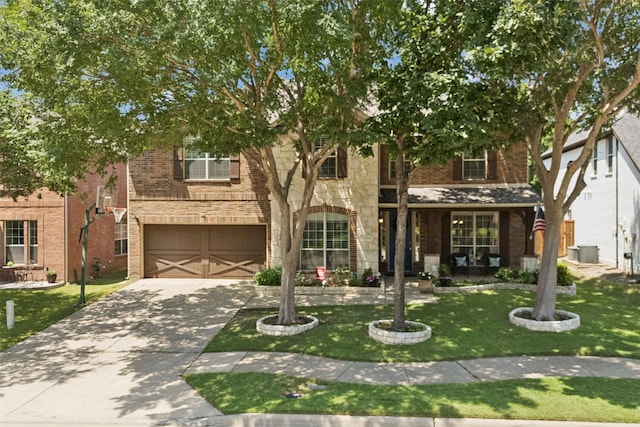 11310 Seguin Dr, Frisco, TX 75035 - view of front of property with an attached garage, driveway, brick siding, and a front lawn