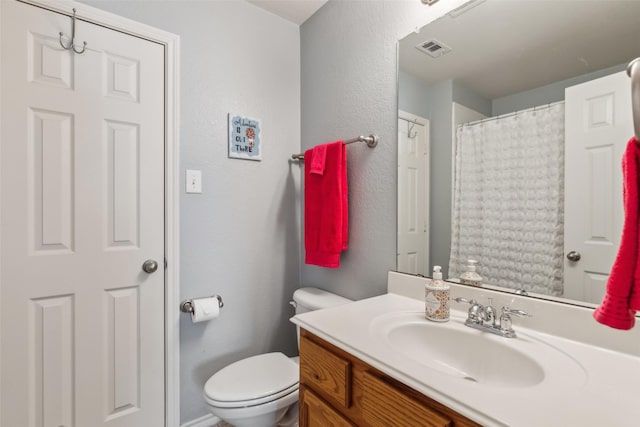 11310 Seguin Dr, Frisco, TX 75035 - full bath with vanity, toilet, and a textured wall