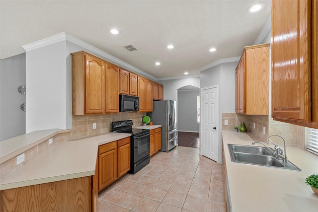 1106 Brook Ridge Ave, Allen, TX 75002 - kitchen featuring black appliances, a sink, crown molding, recessed lighting, and arched walkways