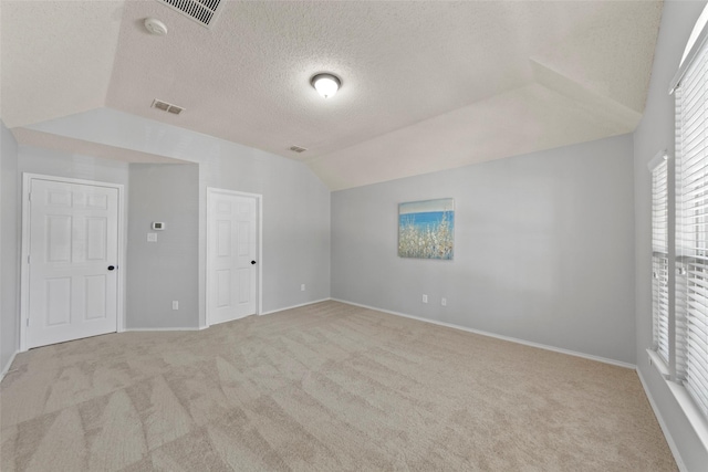 1106 Brook Ridge Ave, Allen, TX 75002 - unfurnished bedroom with carpet flooring, a textured ceiling, lofted ceiling, and baseboards
