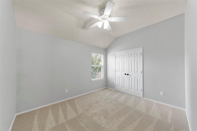 1106 Brook Ridge Ave, Allen, TX 75002 - unfurnished bedroom with carpet flooring, a closet, a textured ceiling, baseboards, and vaulted ceiling