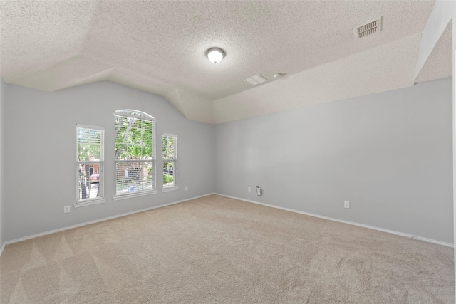 1106 Brook Ridge Ave, Allen, TX 75002 - empty room featuring carpet, vaulted ceiling, a textured ceiling, and baseboards