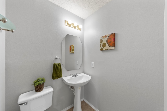 1106 Brook Ridge Ave, Allen, TX 75002 - bathroom featuring toilet, baseboards, and a textured ceiling