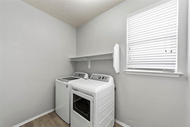 1106 Brook Ridge Ave, Allen, TX 75002 - washroom with washing machine and dryer, wood finished floors, baseboards, and a textured ceiling