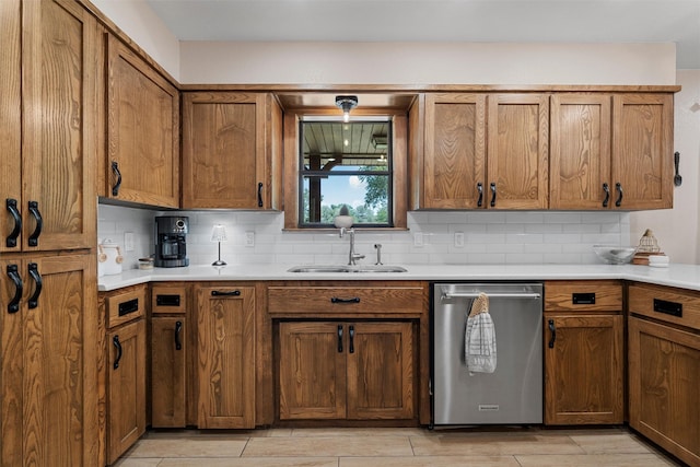 10048 E State Highway 36, Jonesboro, TX 76538 - kitchen featuring dishwasher, a sink, decorative backsplash, and brown cabinetry