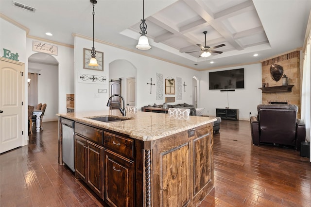 705 La Paloma Rd, Sanger, TX 76266 - kitchen with arched walkways, dishwasher, a sink, a ceiling fan, and beamed ceiling