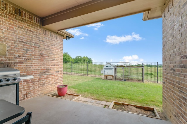 705 La Paloma Rd, Sanger, TX 76266 - view of patio featuring grilling area and a storage unit