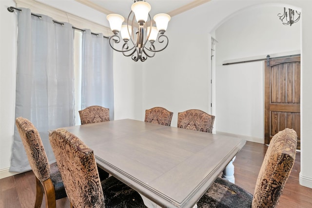 705 La Paloma Rd, Sanger, TX 76266 - dining room featuring a chandelier, arched walkways, wood finished floors, ornamental molding, and baseboards