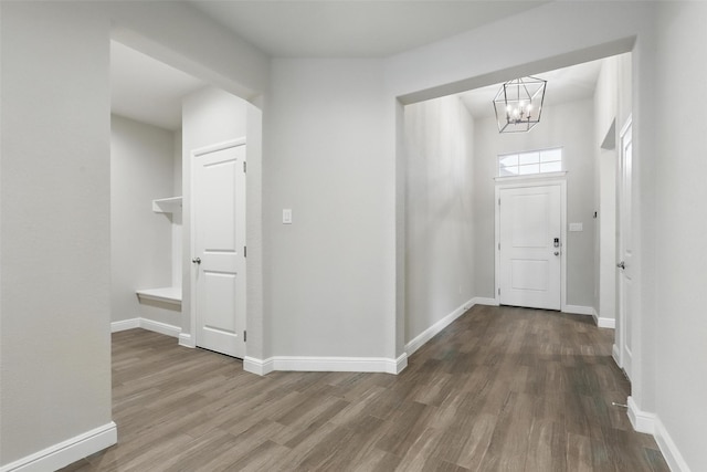 1253 Presidio Ln, Weatherford, TX 76087 - foyer entrance with a chandelier, wood finished floors, and baseboards