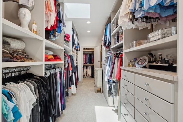 6015 Meadowcreek Dr, Dallas, TX 75248 - walk in closet featuring a skylight and light colored carpet