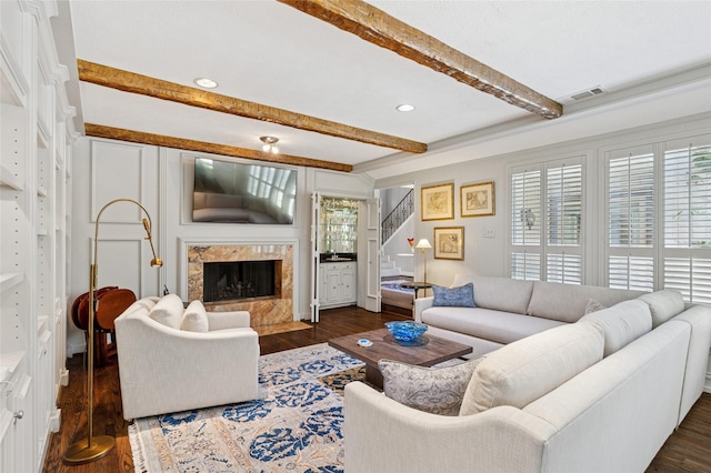 6015 Meadowcreek Dr, Dallas, TX 75248 - living area featuring beam ceiling, dark wood-type flooring, plenty of natural light, stairway, and a premium fireplace