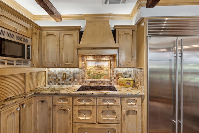 6015 Meadowcreek Dr, Dallas, TX 75248 - kitchen featuring appliances with stainless steel finishes, premium range hood, backsplash, crown molding, and light stone countertops