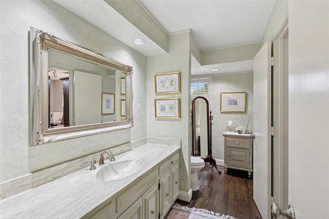 6015 Meadowcreek Dr, Dallas, TX 75248 - bathroom featuring vanity, toilet, and wood finished floors