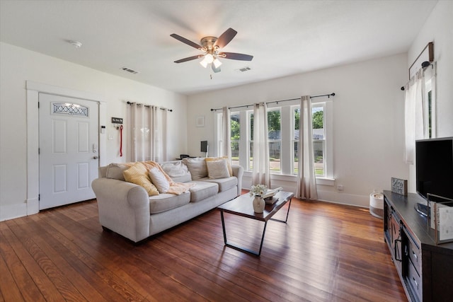 308 W Heard St, Cleburne, TX 76033 - living area featuring a ceiling fan, dark wood finished floors, and baseboards