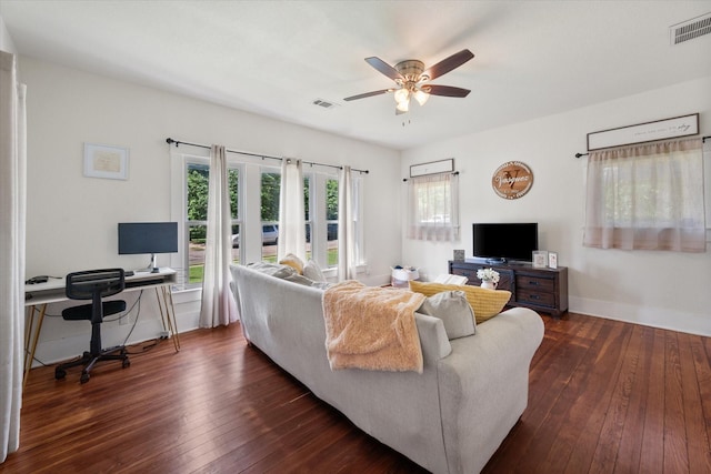 308 W Heard St, Cleburne, TX 76033 - living area with a ceiling fan, dark wood-style floors, baseboards, and a desk