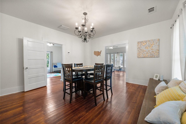308 W Heard St, Cleburne, TX 76033 - dining room featuring a chandelier, hardwood / wood-style floors, and baseboards