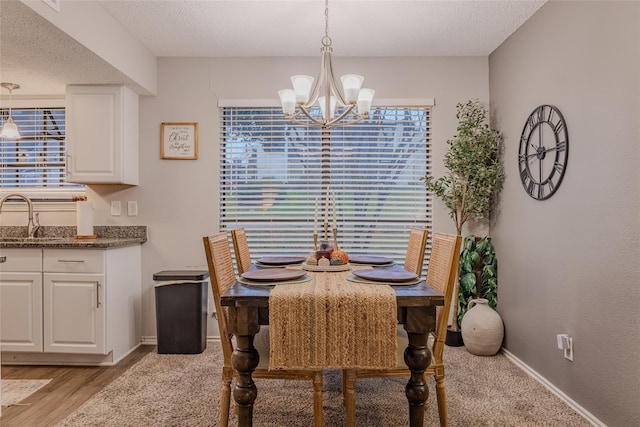 2101 Park Willow Ln Unit A, Arlington, TX 76011 - dining space with a chandelier, a textured ceiling, plenty of natural light, and baseboards