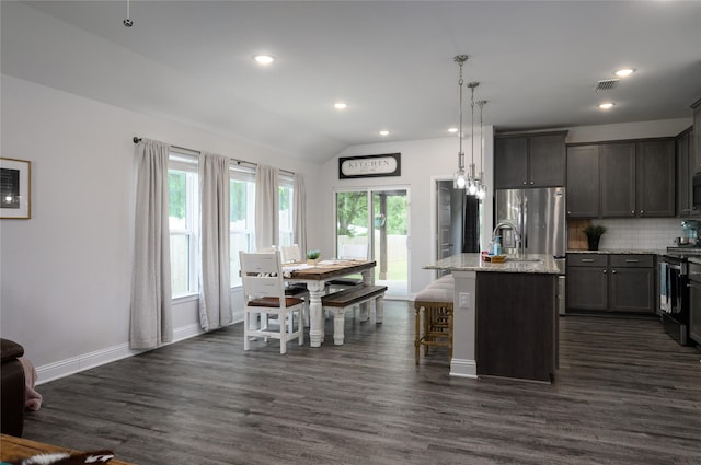 110 Thode St, Whitesboro, TX 76273 - kitchen featuring backsplash, dark wood finished floors, range, recessed lighting, and light stone counters