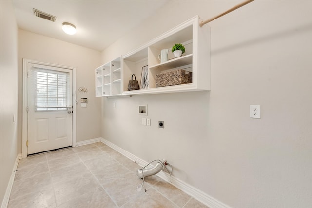 402 Thistle Ct, Southlake, TX 76092 - laundry area with hookup for a washing machine, gas dryer hookup, electric dryer hookup, baseboards, and light tile patterned flooring
