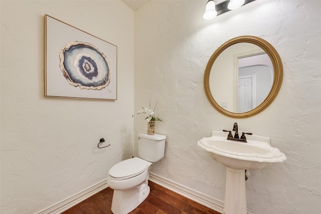 402 Thistle Ct, Southlake, TX 76092 - bathroom featuring wood finished floors, toilet, and baseboards