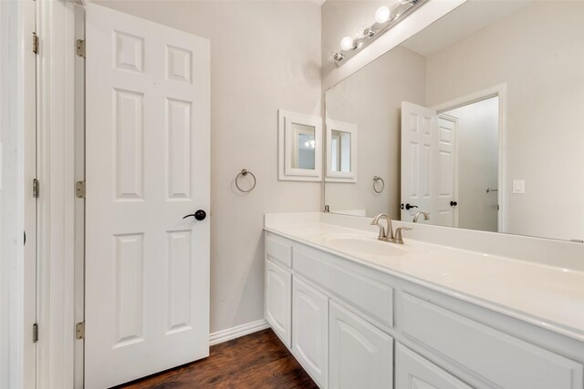 402 Thistle Ct, Southlake, TX 76092 - bathroom with vanity, wood finished floors, and baseboards