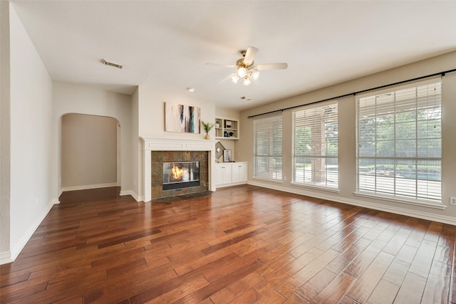 402 Thistle Ct, Southlake, TX 76092 - unfurnished living room with ceiling fan, dark wood-style floors, baseboards, and a tiled fireplace