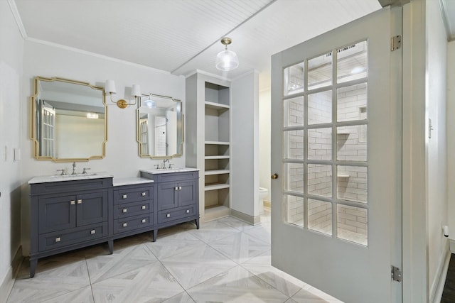 932 N Woods St, Sherman, TX 75092 - full bathroom featuring baseboards, double vanity, toilet, and plenty of natural light