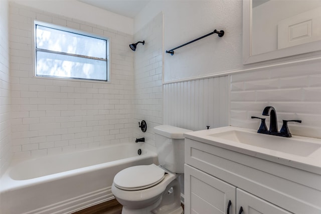 4104 Valentine St, Fort Worth, TX 76107 - bathroom with toilet, vanity, shower / washtub combination, wainscoting, and wood finished floors