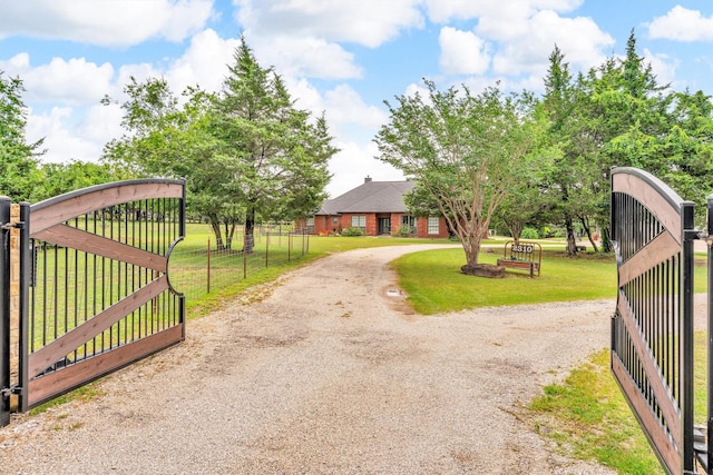 2310 N Walnut Grove Rd, Midlothian, TX 76065 - view of front of house featuring a gate and gravel driveway