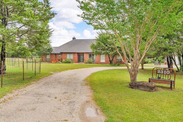 2310 N Walnut Grove Rd, Midlothian, TX 76065 - entrance to property featuring brick siding, a shingled roof, and a chimney