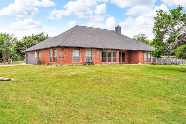 2310 N Walnut Grove Rd, Midlothian, TX 76065 - back of property with a garage, brick siding, a chimney, a shingled roof, and driveway
