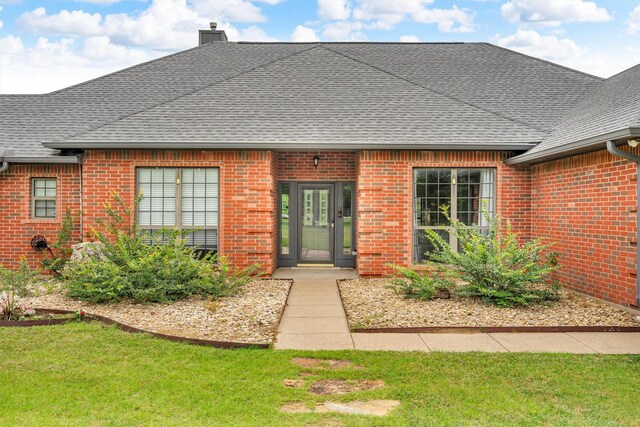 2310 N Walnut Grove Rd, Midlothian, TX 76065 - view of front of house featuring brick siding, driveway, a garage, roof with shingles, and cooling unit