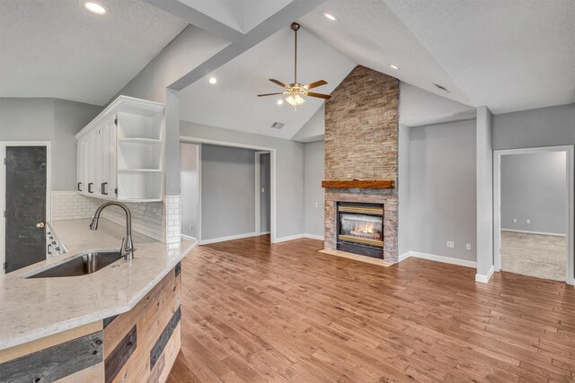 2310 N Walnut Grove Rd, Midlothian, TX 76065 - living area featuring a ceiling fan, a textured ceiling, and light colored carpet