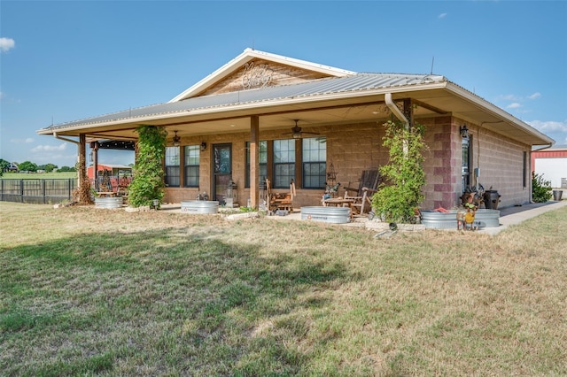 395 Yacht Cb Rd, Oak Point, TX 75068 - back of house featuring a ceiling fan, metal roof, and concrete block siding