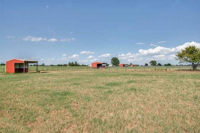 395 Yacht Cb Rd, Oak Point, TX 75068 - view of yard featuring a pole building, a view of countryside, and an outdoor structure