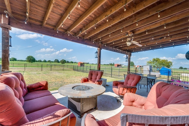 395 Yacht Cb Rd, Oak Point, TX 75068 - view of patio with a view of rural / pastoral area, ceiling fan, and an outdoor living space with a fire pit