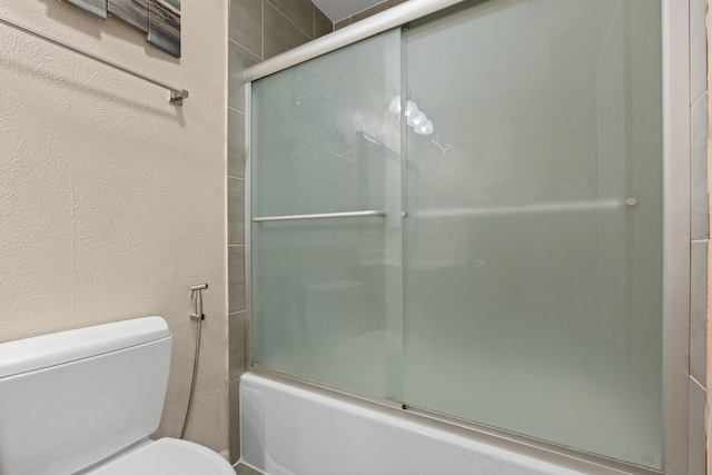 7504 Kingsmill Ter, Fort Worth, TX 76112 - full bathroom with toilet and enclosed tub / shower combo