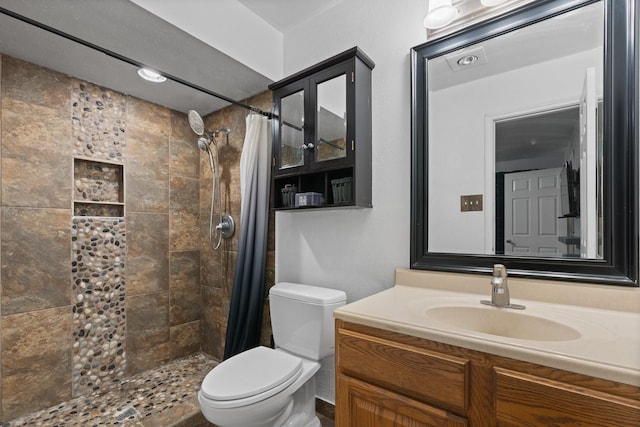 7504 Kingsmill Ter, Fort Worth, TX 76112 - bathroom featuring toilet, a tile shower, and vanity
