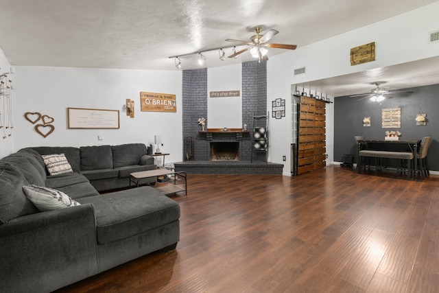 7504 Kingsmill Ter, Fort Worth, TX 76112 - living room featuring ceiling fan, a fireplace, and wood finished floors