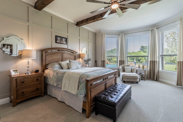 3340 Pleasantville Rd, Midlothian, TX 76065 - bedroom featuring light colored carpet, beamed ceiling, a decorative wall, a ceiling fan, and crown molding