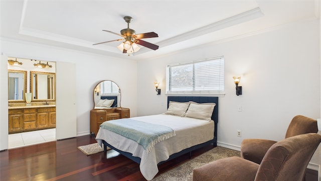 411 Roaring Springs Dr, Allen, TX 75002 - bedroom with a tray ceiling, ornamental molding, a sink, wood finished floors, and ensuite bathroom