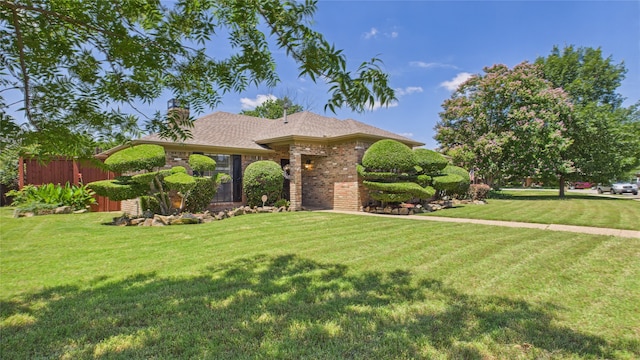 411 Roaring Springs Dr, Allen, TX 75002 - view of front of house featuring brick siding, a front lawn, and roof with shingles