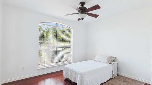 411 Roaring Springs Dr, Allen, TX 75002 - bedroom with baseboards, ornamental molding, wood finished floors, and ceiling fan
