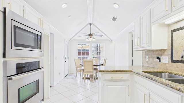 411 Roaring Springs Dr, Allen, TX 75002 - kitchen with stainless steel appliances, ornamental molding, baseboards, decorative backsplash, and light tile patterned floors