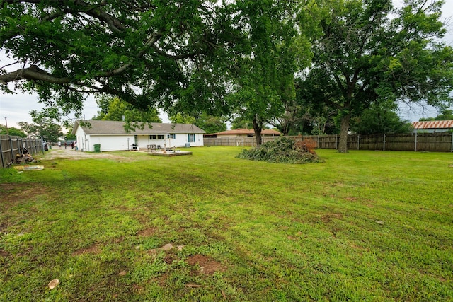 440 S Main St, Springtown, TX 76082 - fenced backyard with a patio area