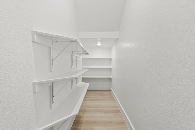 4523 Wahoo St, Dallas, TX 75210 - walk in closet with light wood-type flooring