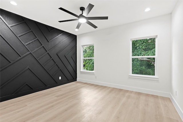4523 Wahoo St, Dallas, TX 75210 - spare room with wood finished floors, baseboards, recessed lighting, a ceiling fan, and a decorative wall