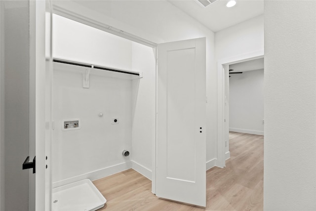 4523 Wahoo St, Dallas, TX 75210 - laundry room with electric dryer hookup, light wood-style flooring, gas dryer hookup, washer hookup, and baseboards