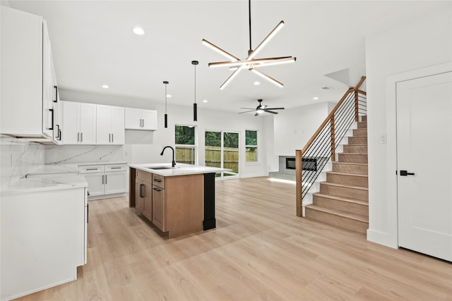 4523 Wahoo St, Dallas, TX 75210 - kitchen featuring a sink, recessed lighting, ceiling fan, light wood finished floors, and open floor plan