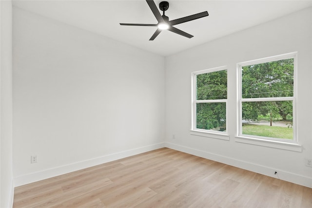 4523 Wahoo St, Dallas, TX 75210 - empty room featuring baseboards, light wood finished floors, and ceiling fan